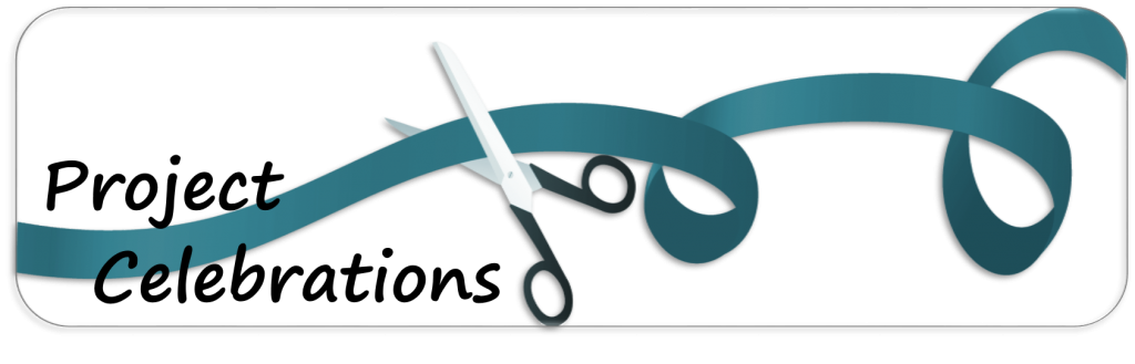 A scissor cutting a ribbon