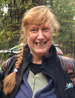Woman with blond braid smiling