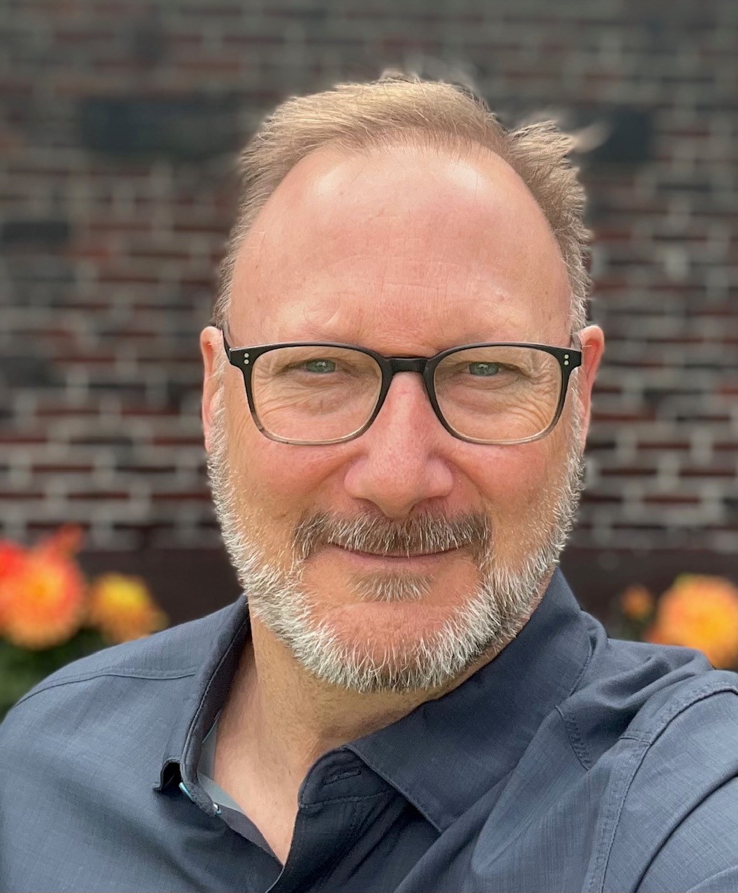 Man with glasses and short beard